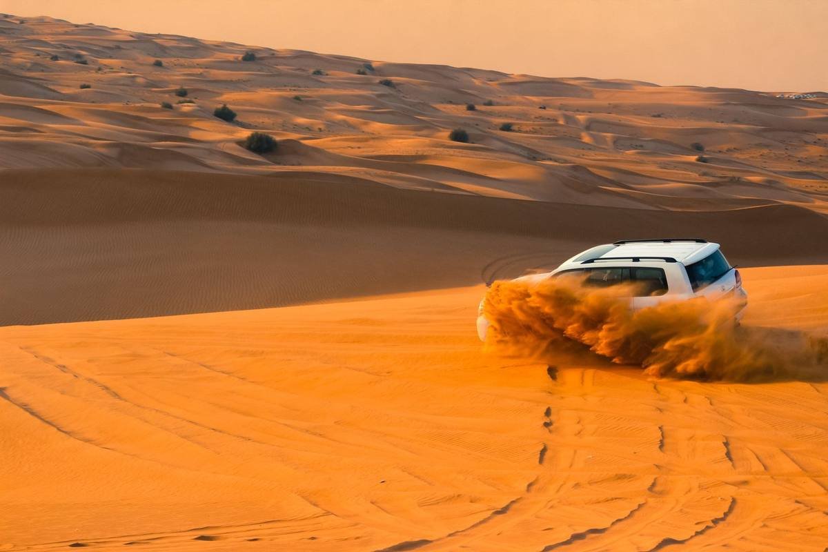 4x4 dune bashing in the Dubai desert at sunset